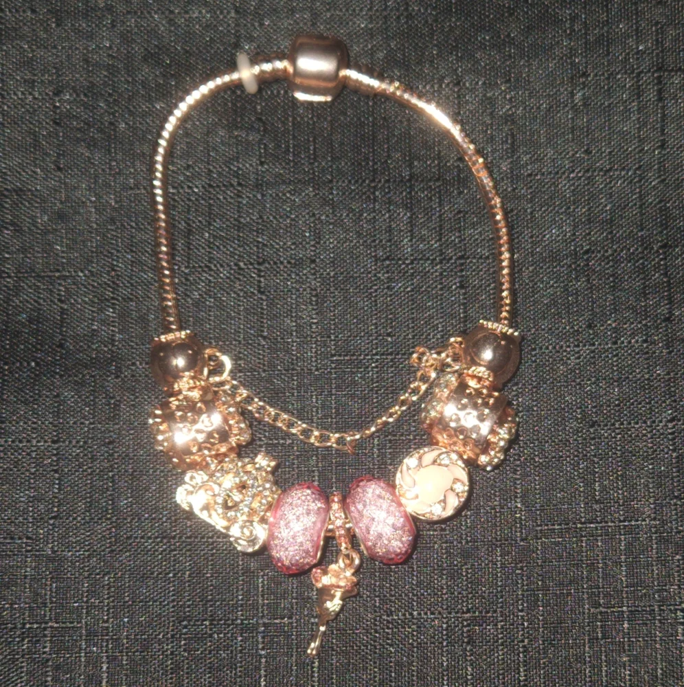 Gold and Pink Charm Bracelet with Ornate Charms. ITEM No. 19-144